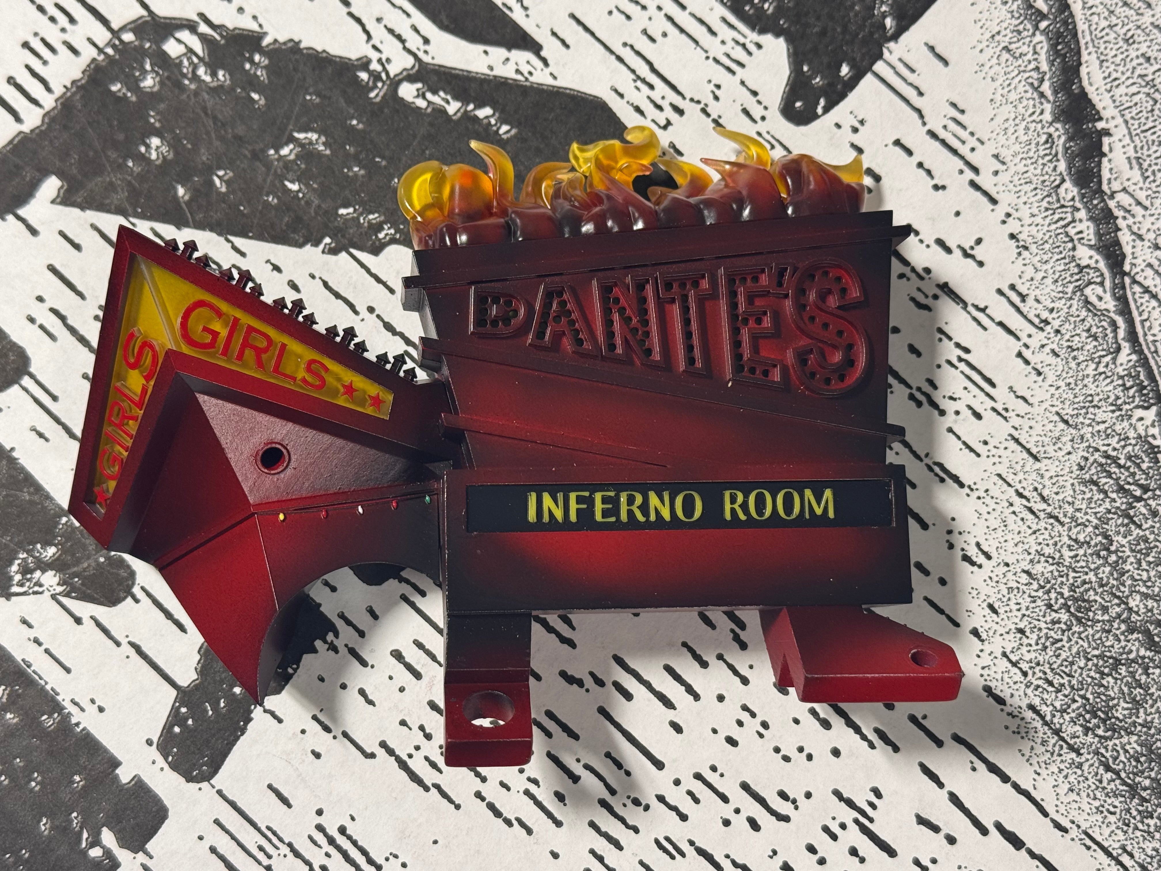Dante’s Inferno building and adjoining GIRLS sign section shown together on a black-and-white surface